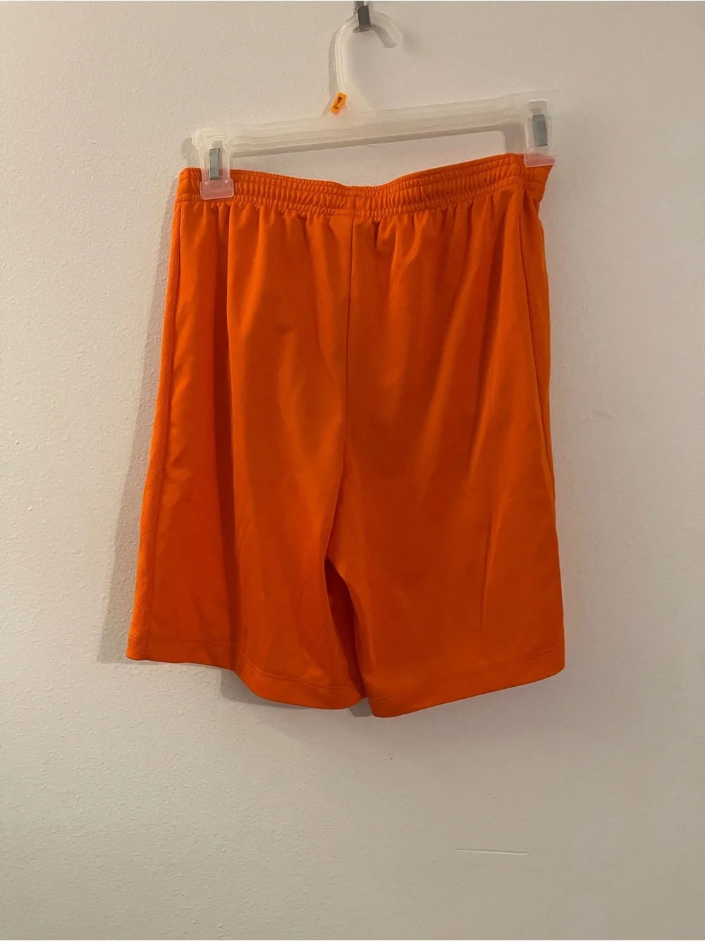 Nike Girl's Bright Orange Athletic Shorts with White Swoosh